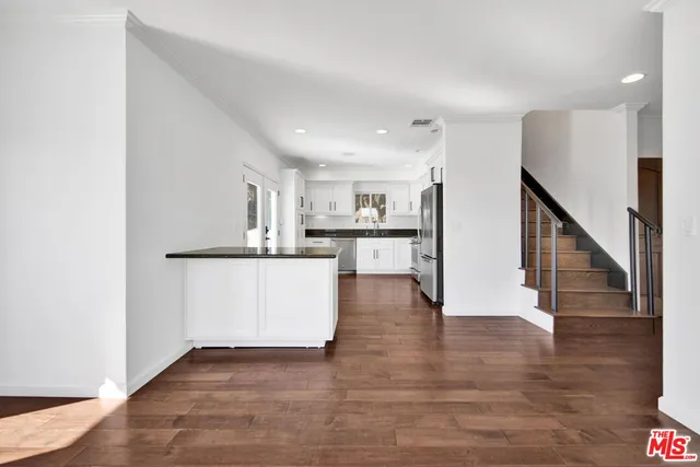 a view of kitchen with wooden floor