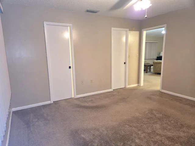 a view of a livingroom and a hallway