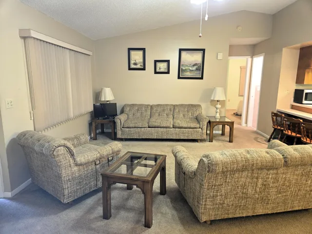 a bedroom with a bed and a couch