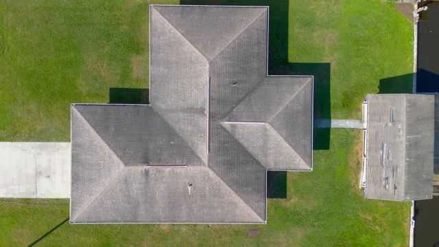 an aerial view of a house with swimming pool