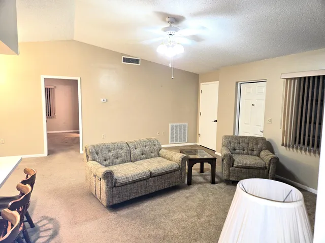 a living room with furniture and a couch