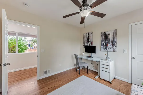 a kitchen with stainless steel appliances granite countertop a refrigerator a stove and a sink