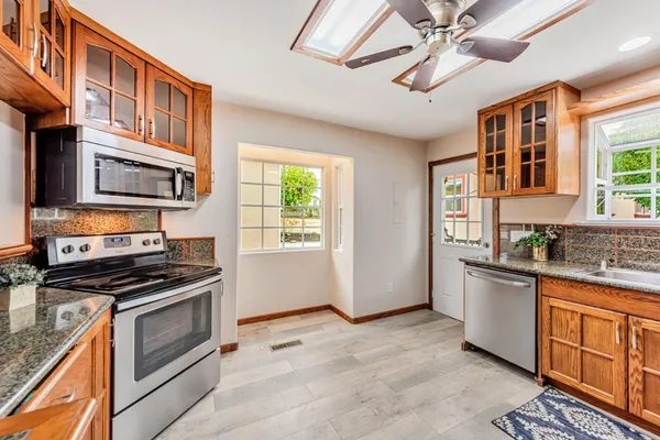 a view of a backyard of the house