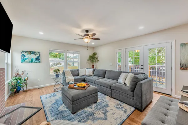 a living room with furniture and a flat screen tv