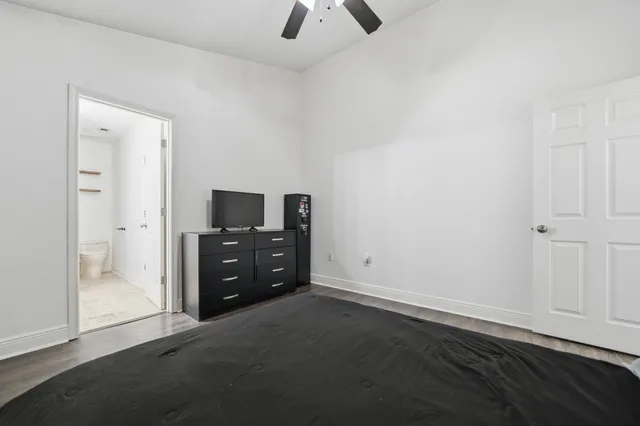 an empty room with cabinet and a flat tv screen