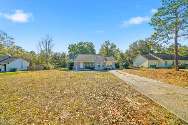 an aerial view of a house with lake view