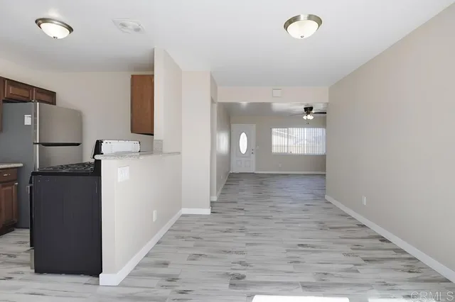 a view of a kitchen cabinets and wooden floor
