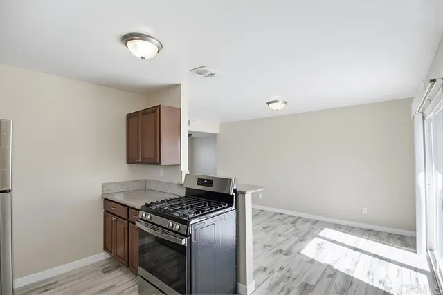 a kitchen with a stove and a microwave