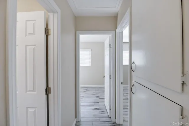 a bathroom with a glass door shower and a sink