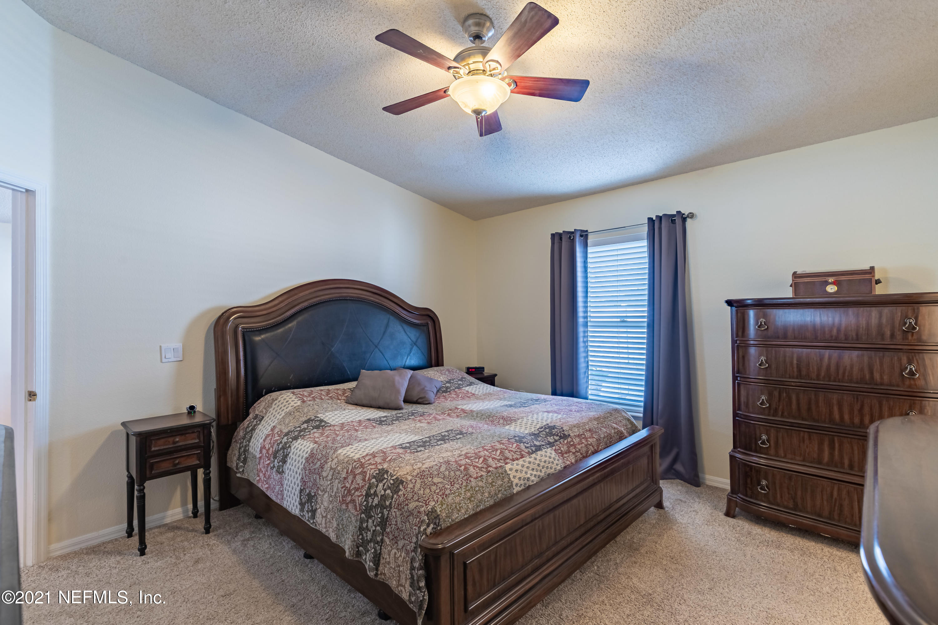 2602 Sunrise Ridge Lane Jacksonville, FL 32277 - Photo 20 of 35 a bedroom with a bed and closet