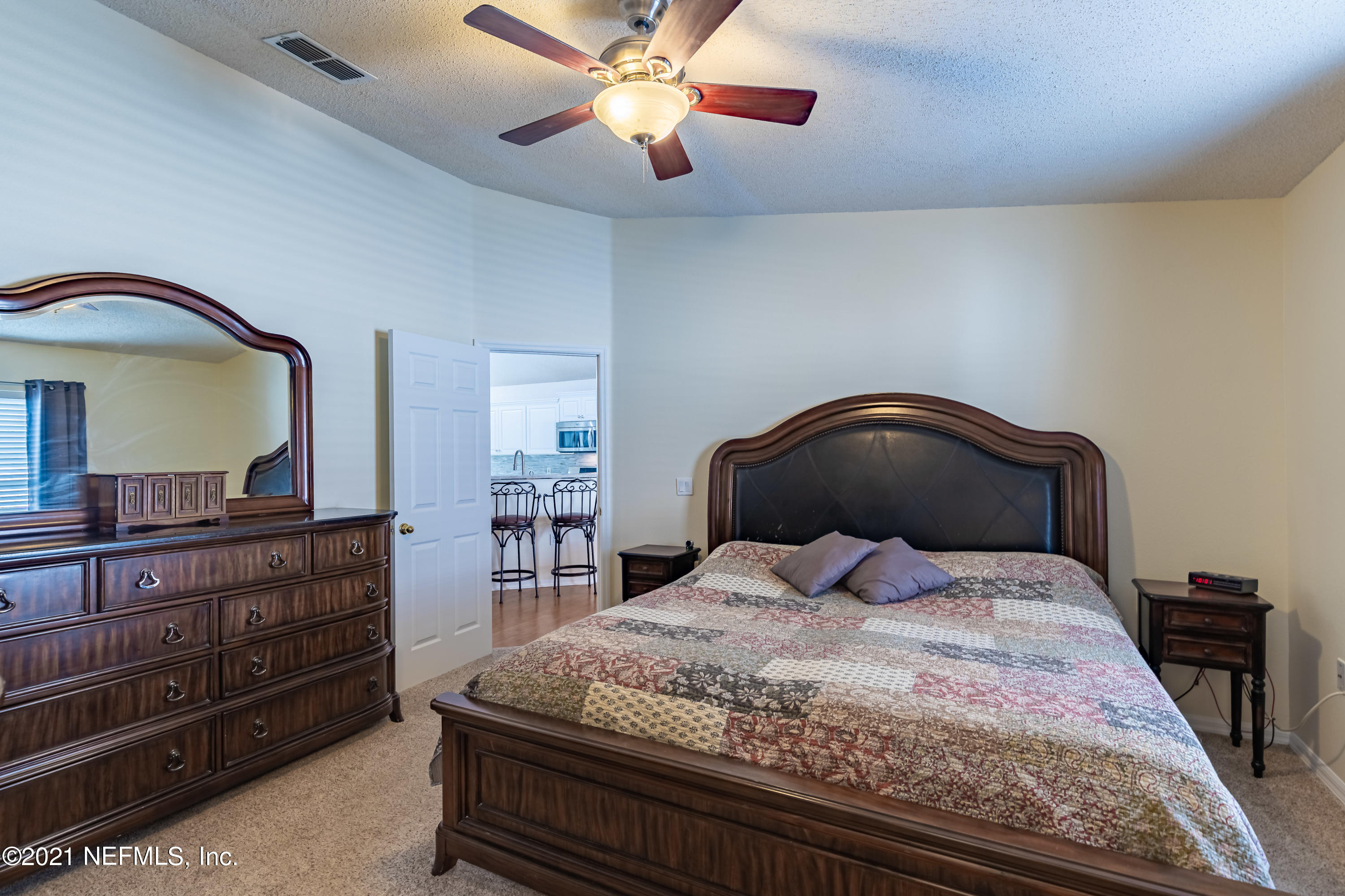 2602 Sunrise Ridge Lane Jacksonville, FL 32277 - Photo 21 of 35 a bedroom with a bed and a dresser