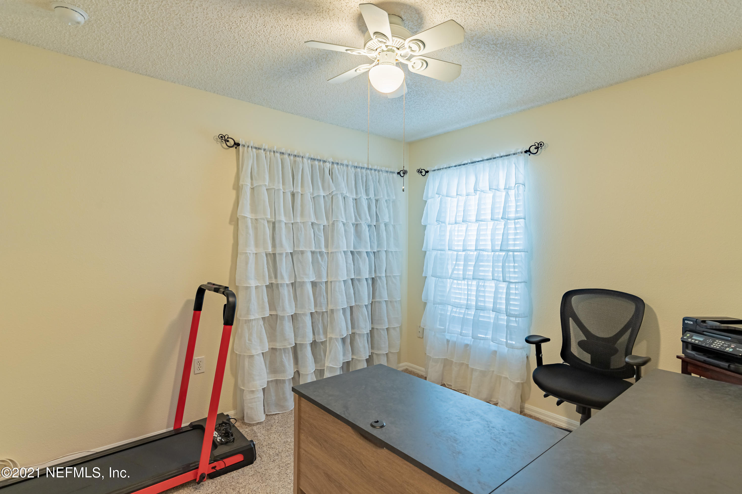 2602 Sunrise Ridge Lane Jacksonville, FL 32277 - Photo 27 of 35 a view of a workspace with furniture and a window