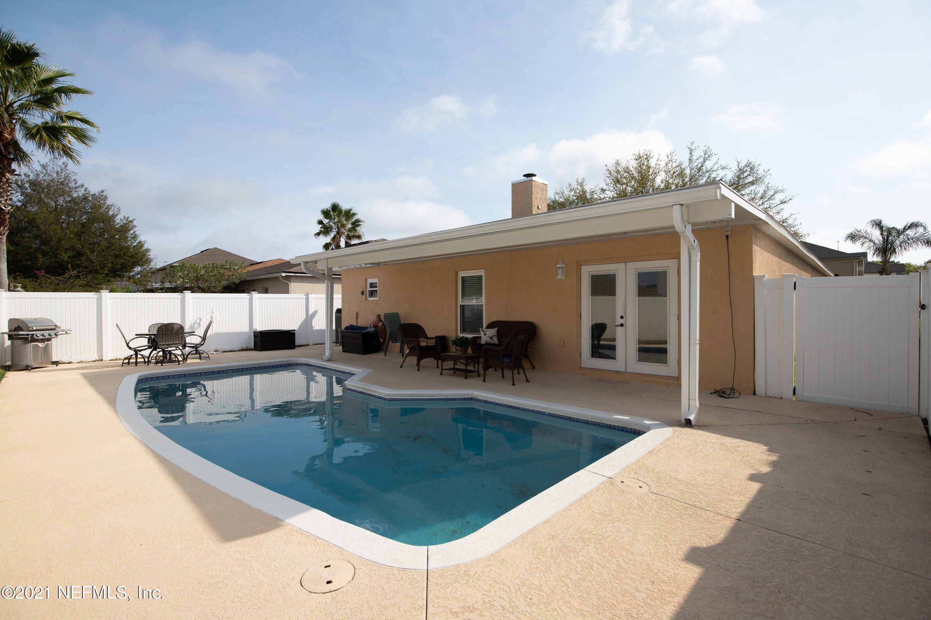 2602 Sunrise Ridge Lane Jacksonville, FL 32277 - Photo 34 of 35 a view of a house with pool and a yard