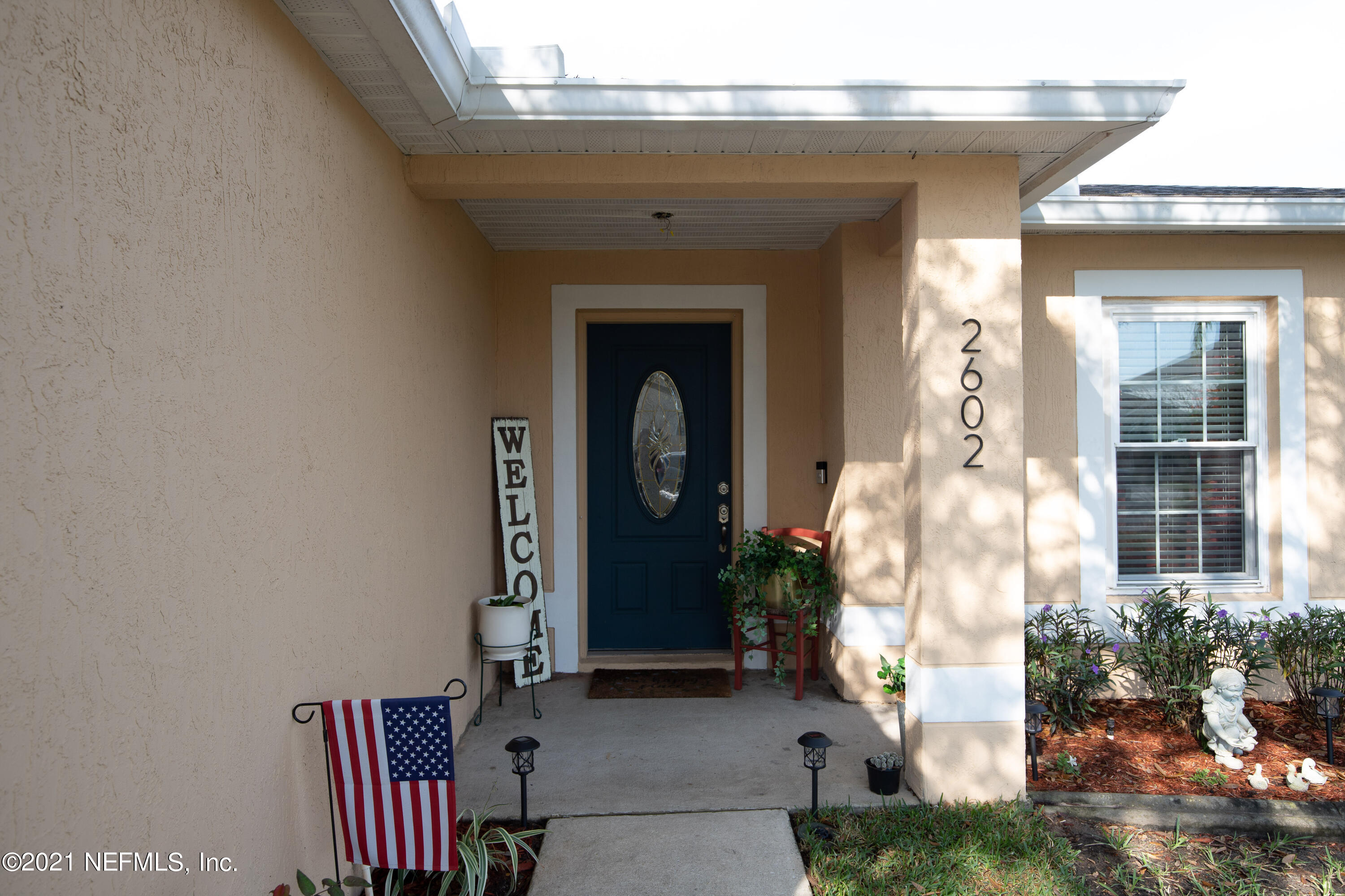 2602 Sunrise Ridge Lane Jacksonville, FL 32277 - Photo 4 of 35 a front view of a house with garden