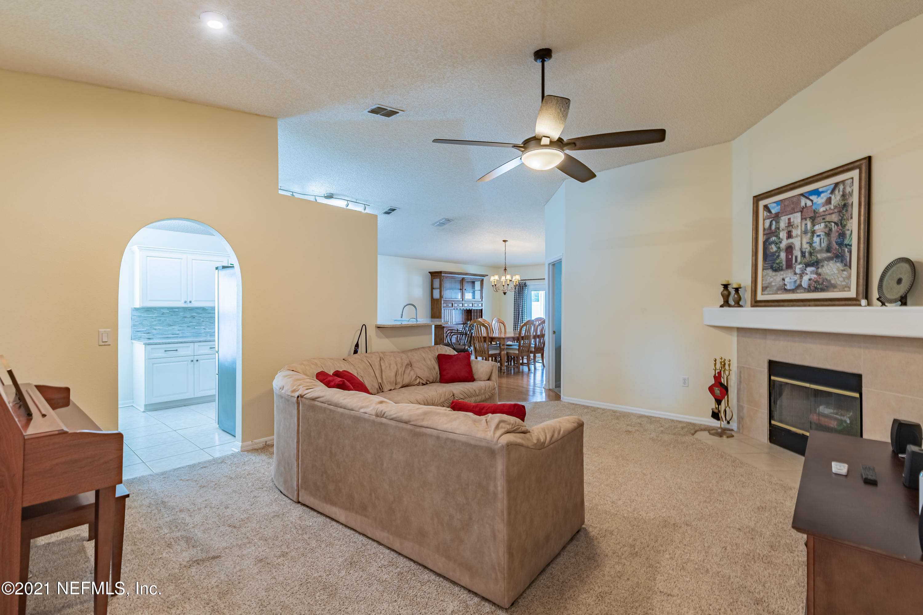 2602 Sunrise Ridge Lane Jacksonville, FL 32277 - Photo 7 of 35 a living room with furniture and a fireplace