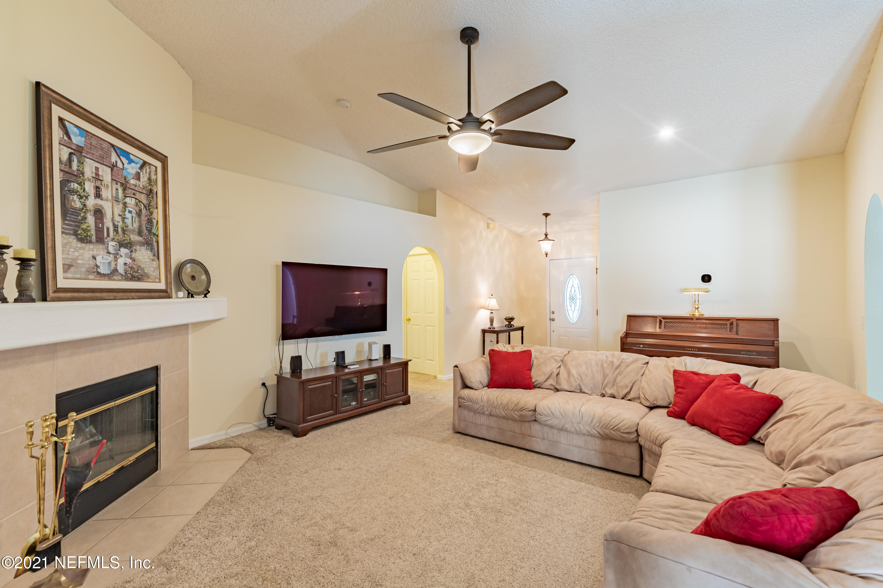 2602 Sunrise Ridge Lane Jacksonville, FL 32277 - Photo 10 of 35 a living room with furniture and a flat screen tv