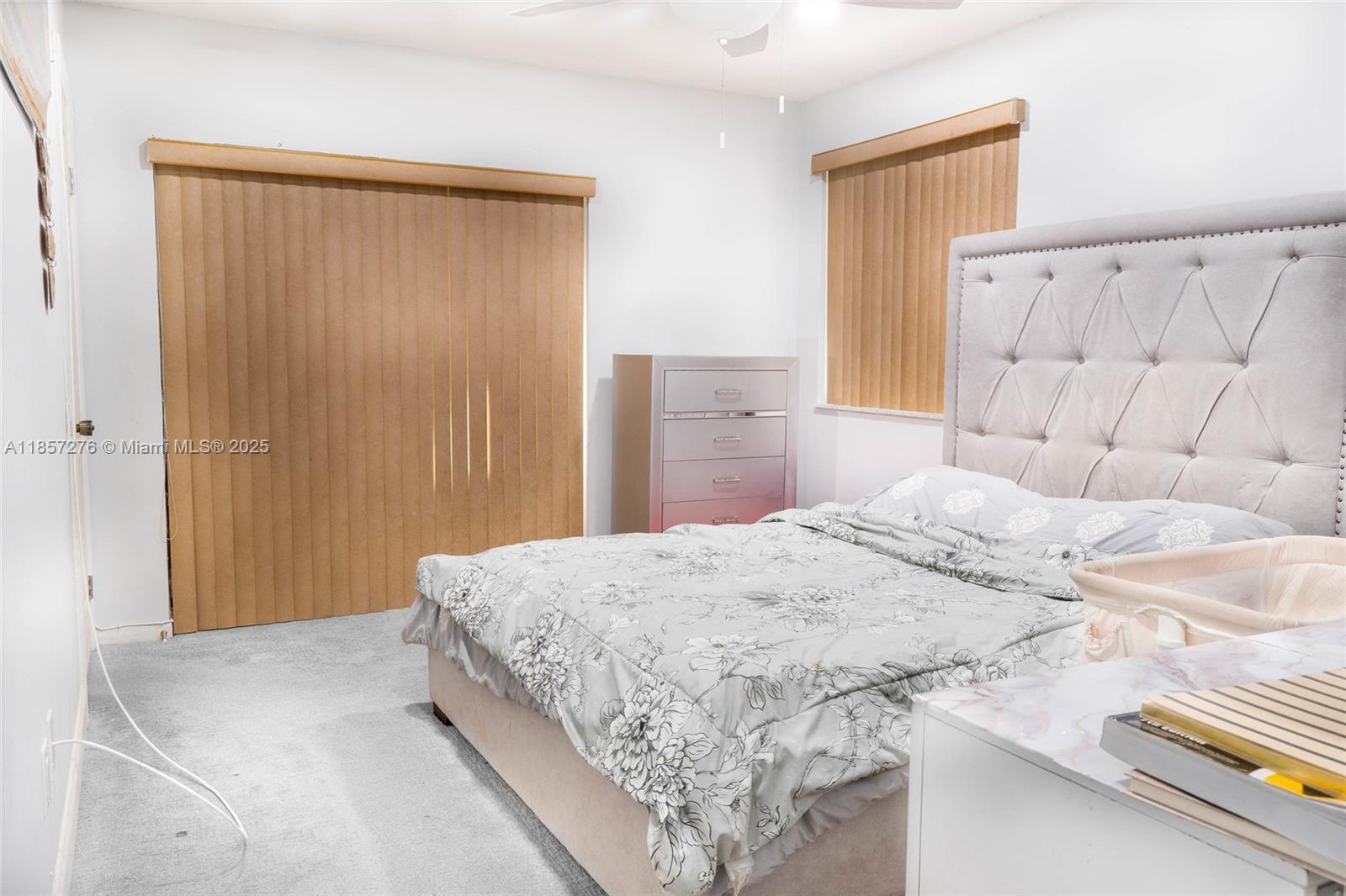 20300 Northeast 3rd Court, Unit 6 Miami, FL 33179 - Photo 9 of 14 a bedroom with a bed and a dresser