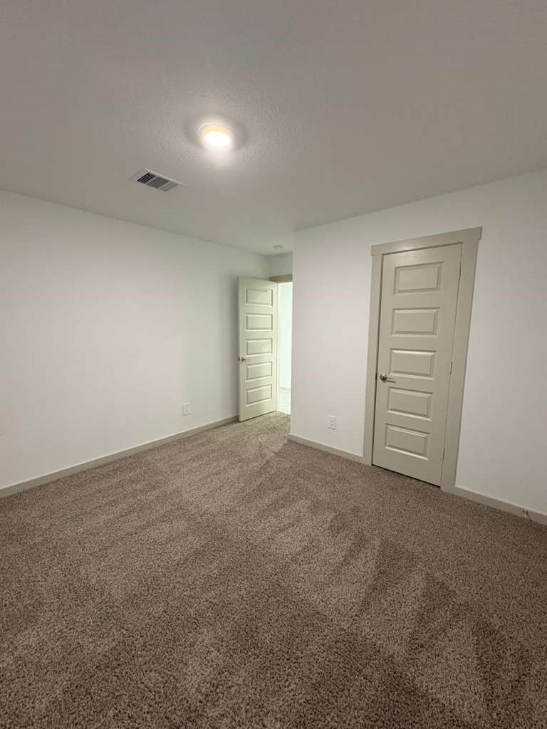 30018 Reagans Rnch Drive Fulshear, TX 77494 - Photo 13 of 30 a view of an empty room with a window