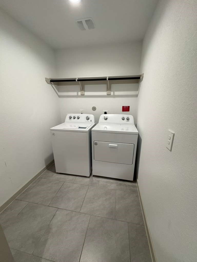 30018 Reagans Rnch Drive Fulshear, TX 77494 - Photo 16 of 30 a utility room with dryer and washer