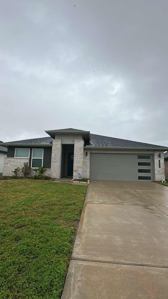 30018 Reagans Rnch Drive Fulshear, TX 77494 - Photo 2 of 30 a house view with a garden space