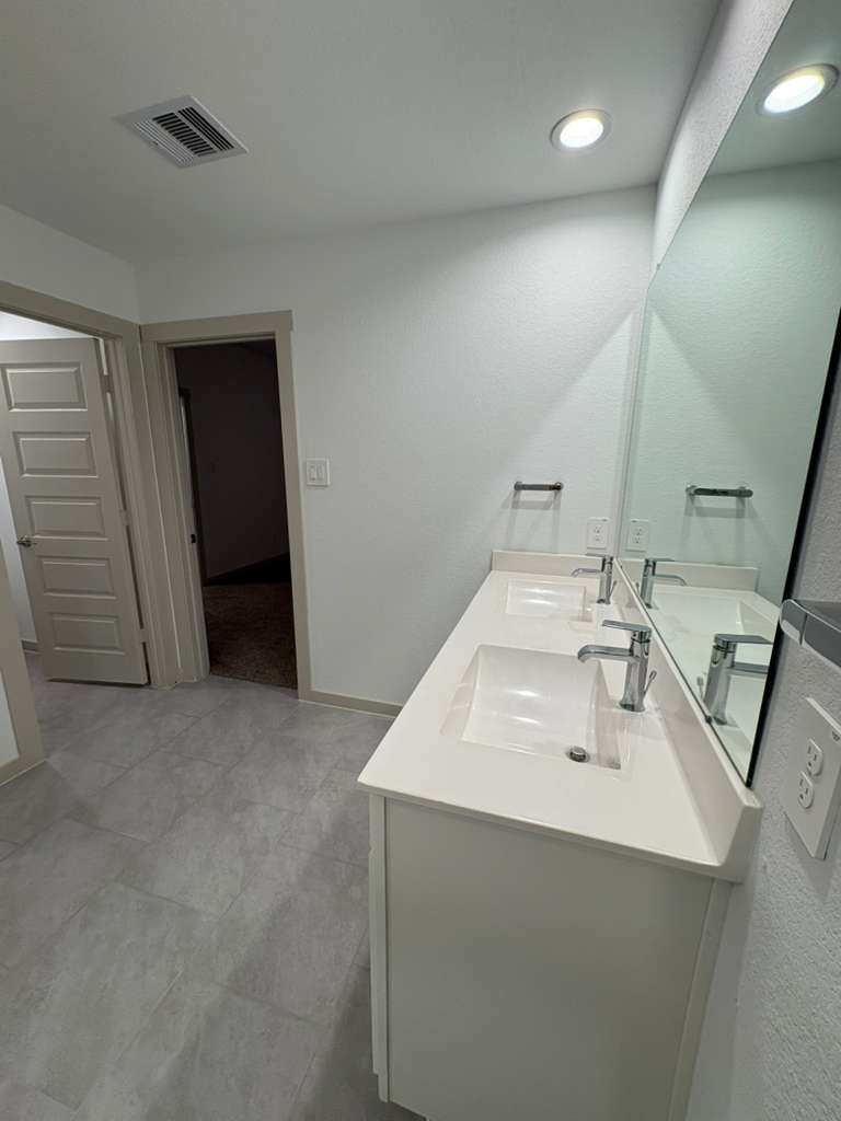 30018 Reagans Rnch Drive Fulshear, TX 77494 - Photo 25 of 30 a bathroom with a sink and a mirror