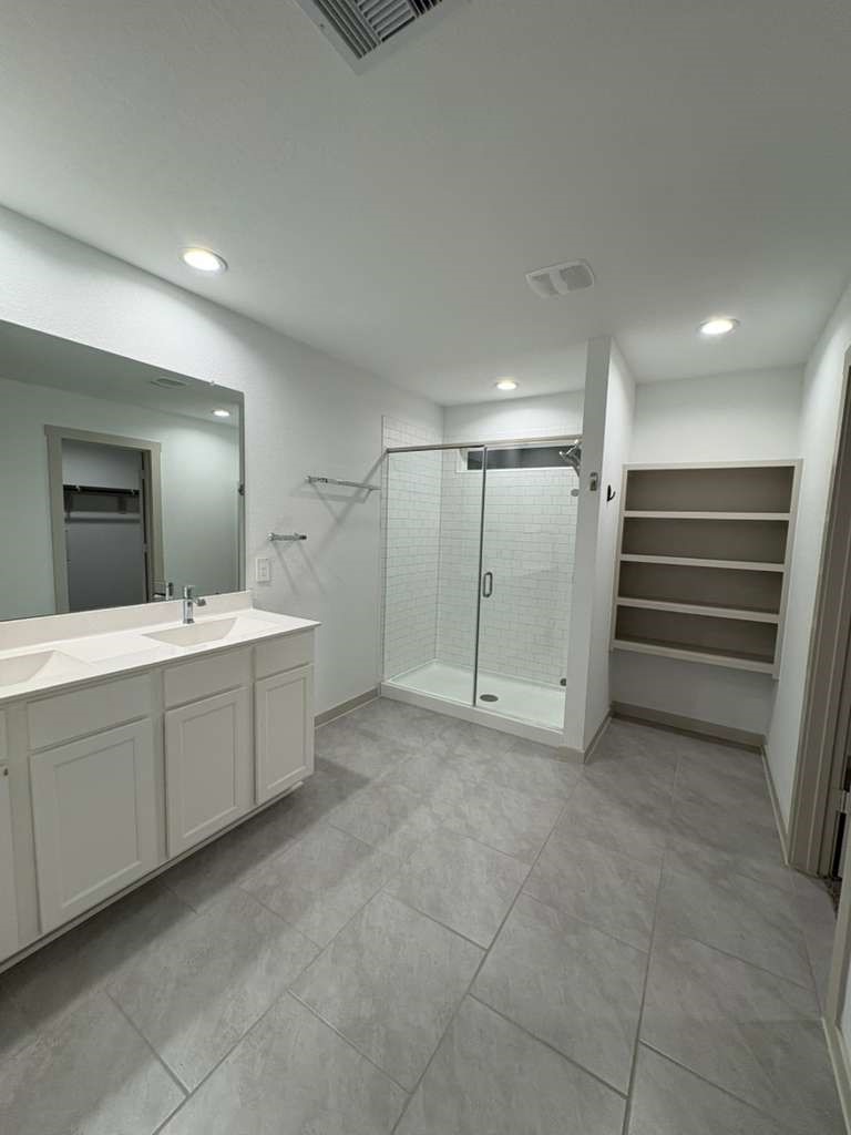 30018 Reagans Rnch Drive Fulshear, TX 77494 - Photo 27 of 30 a bathroom with a sink and mirror