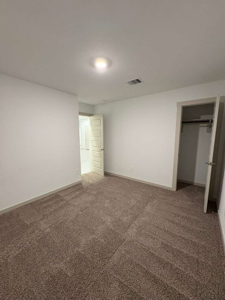 30018 Reagans Rnch Drive Fulshear, TX 77494 - Photo 7 of 30 a view of an empty room and a window