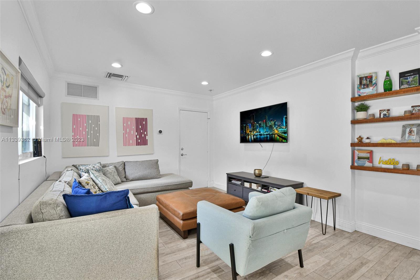 Dadeland Miami, FL 33173 - Photo 13 of 56 a living room with furniture and a flat screen tv