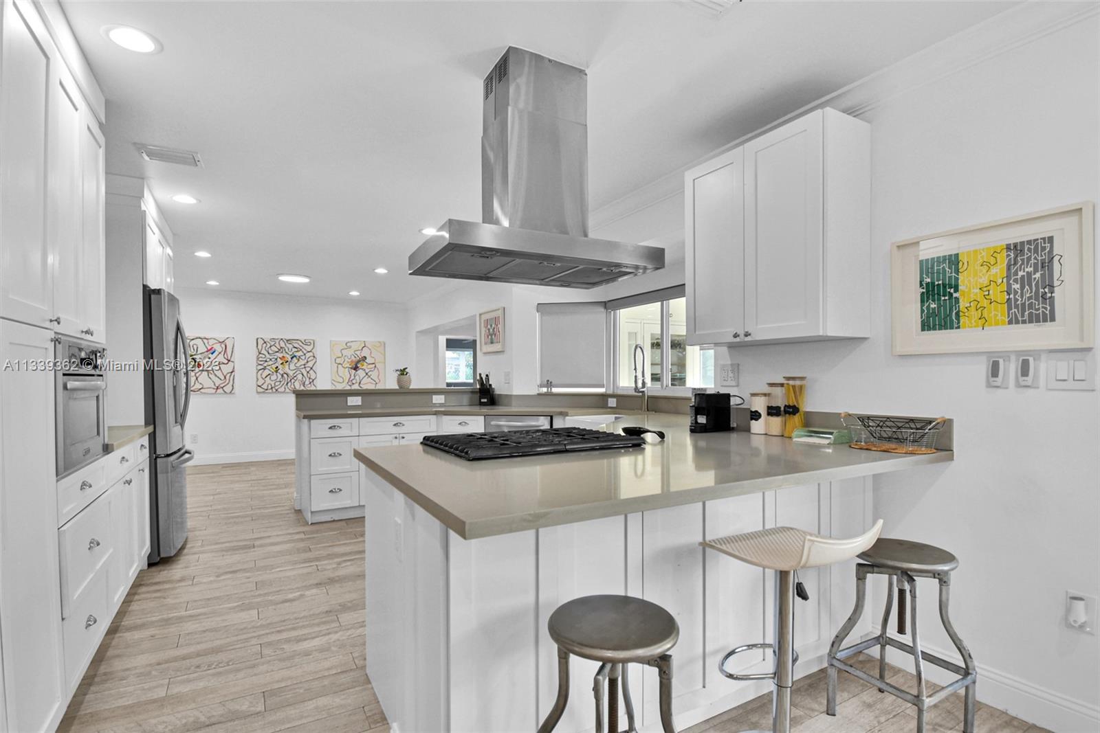 Dadeland Miami, FL 33173 - Photo 16 of 56 a kitchen with stainless steel appliances a sink a stove a refrigerator and cabinets