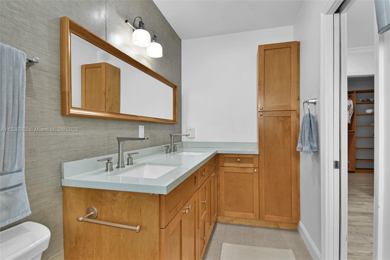 Dadeland Miami, FL 33173 - Photo 31 of 56 a bathroom with a sink vanity and a mirror