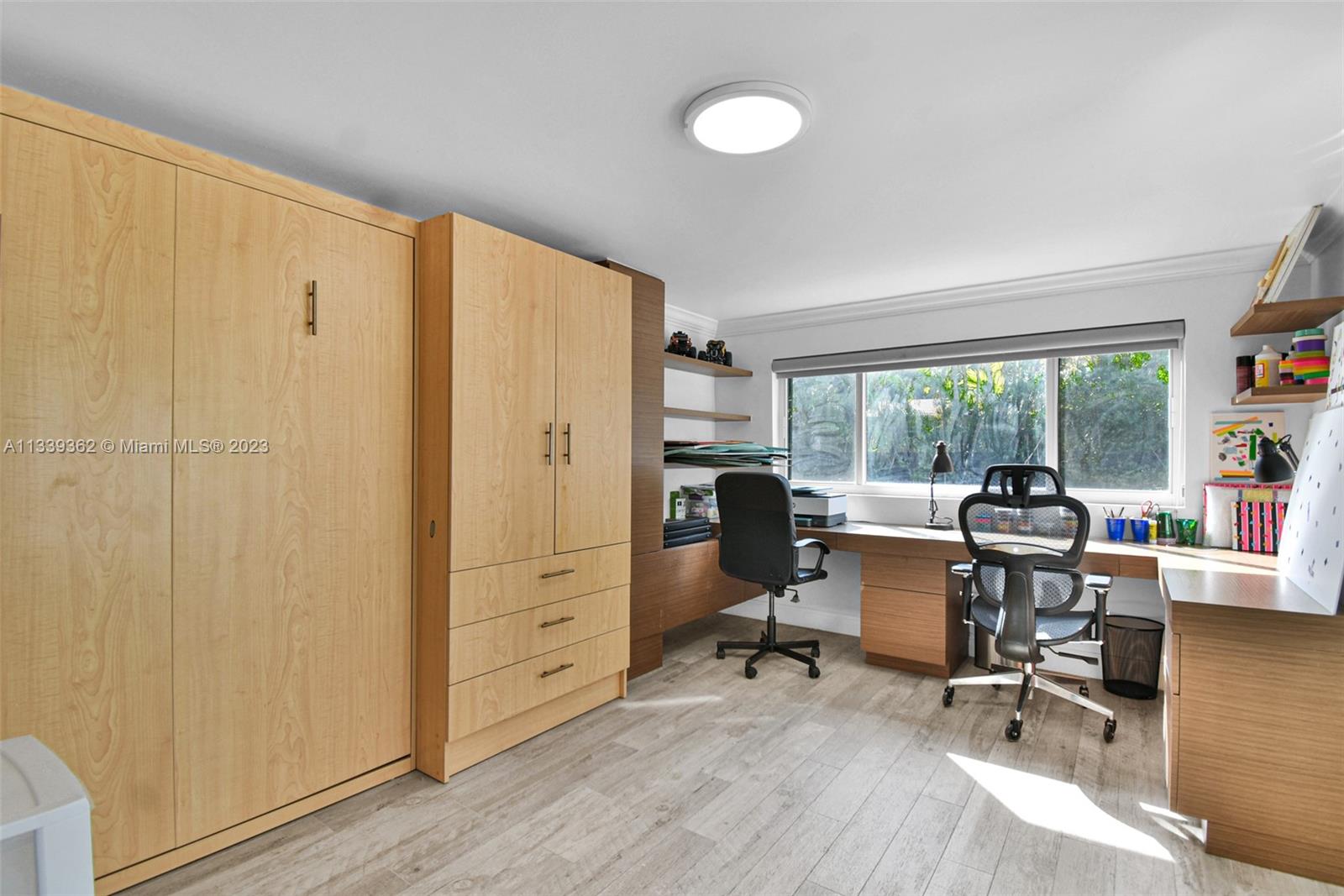Dadeland Miami, FL 33173 - Photo 44 of 56 a view of a livingroom with workspace and a window