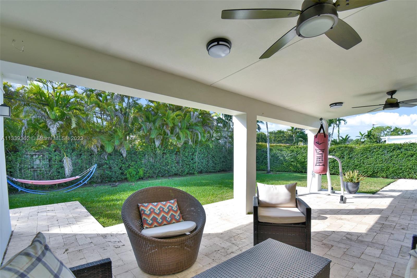 Dadeland Miami, FL 33173 - Photo 47 of 56 a patio with garden area and outdoor seating