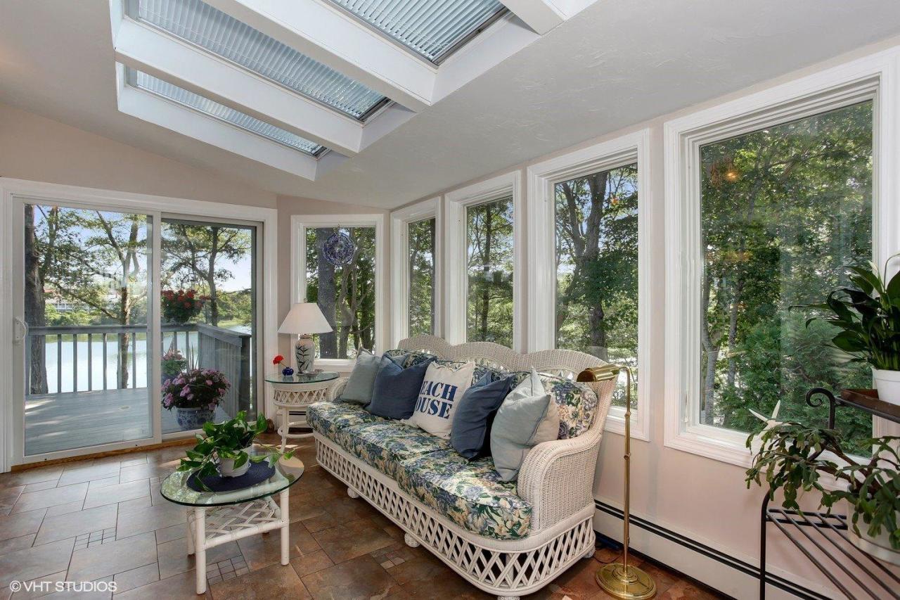 18 Quamhassett Road Buzzards Bay, MA 02532 - Photo 7 of 31 a living room with furniture and floor to ceiling windows
