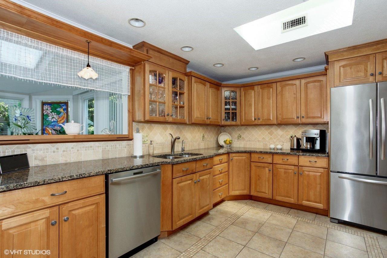 18 Quamhassett Road Buzzards Bay, MA 02532 - Photo 9 of 31 a kitchen with stainless steel appliances granite countertop a refrigerator and a sink