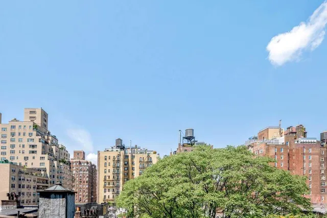 a view of a city with tall buildings in the background