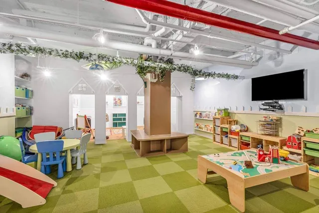 a living room with patio furniture and a flat screen tv