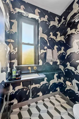 a table with wine bottles and glasses on it