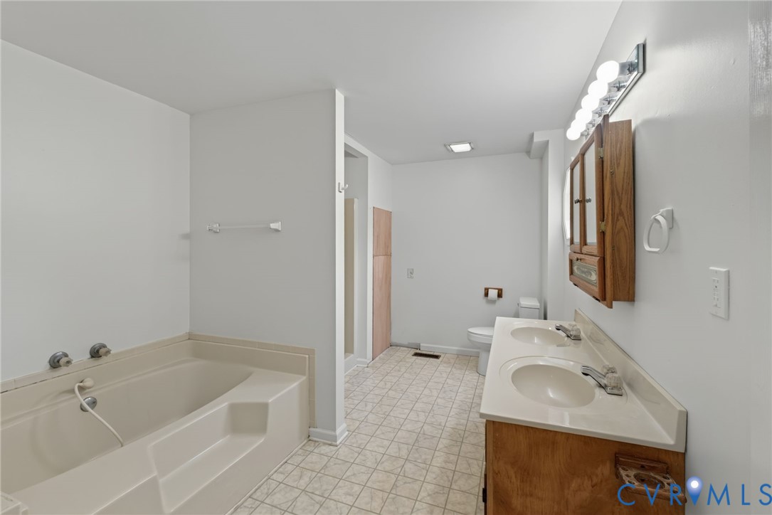 3007 Five Forks Road Pamplin, VA 23958 - Photo 29 of 82 Dual-sink vanity with a light-toned countertop, bu