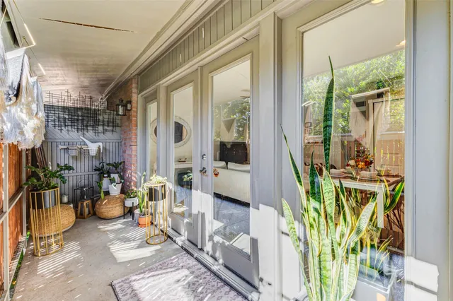 a view of a path along with potted plants