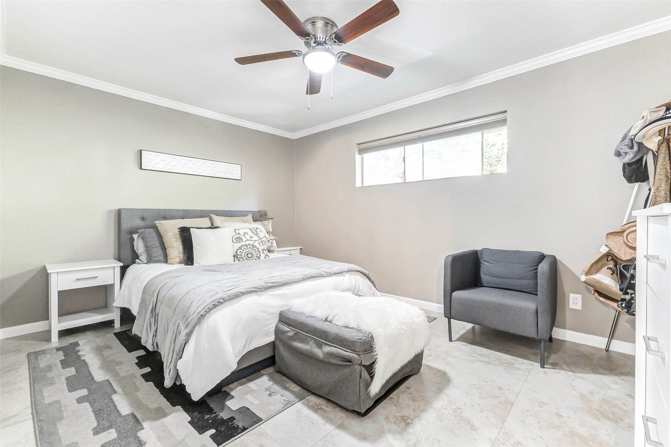 3928 West Alabama Street, Unit 4 Houston, TX 77027 - Photo 10 of 33 This cozy bedroom features a neutral color scheme. Natural light fills the room through a wide window, enhancing the inviting atmosphere.