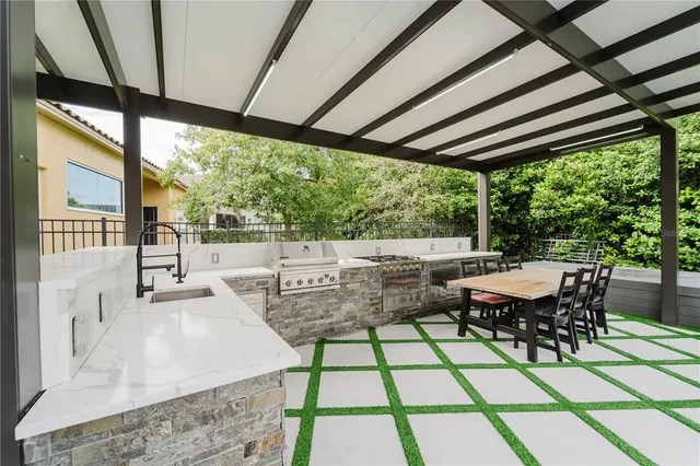 a view of a patio with table and chairs and wooden floor