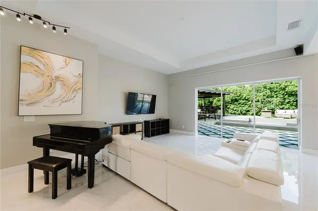 a living room with furniture and a large window