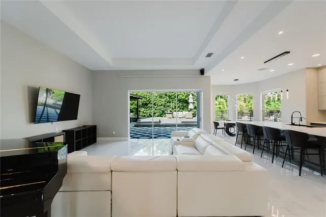 a kitchen with a large window and furniture