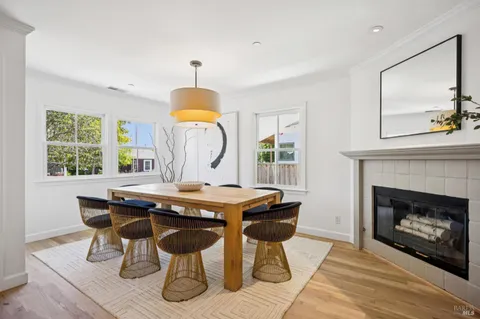 a view of a dining room with a table and chairs