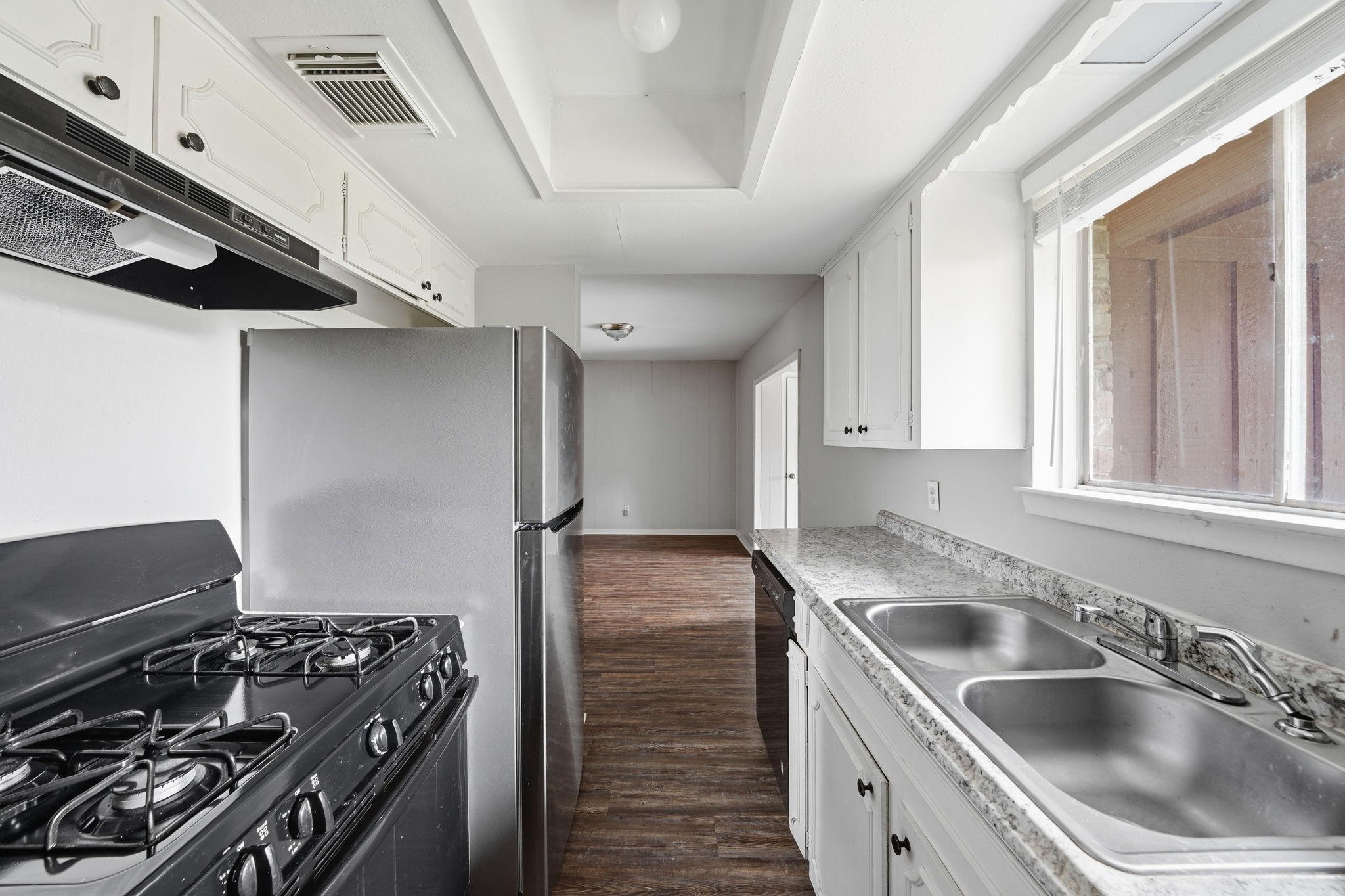 6410 Hopper Road Houston, TX 77016 - Photo 15 of 28 a kitchen that has a sink and a stove