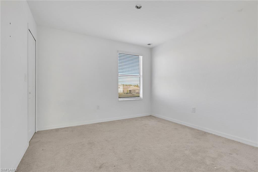 2553 Kona Way Naples, FL 34120 - Photo 17 of 27 a view of an empty room with a window