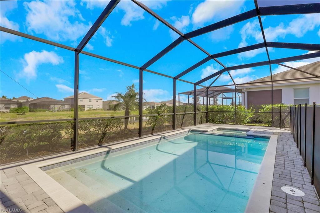 2553 Kona Way Naples, FL 34120 - Photo 23 of 27 a view of swimming pool with a patio