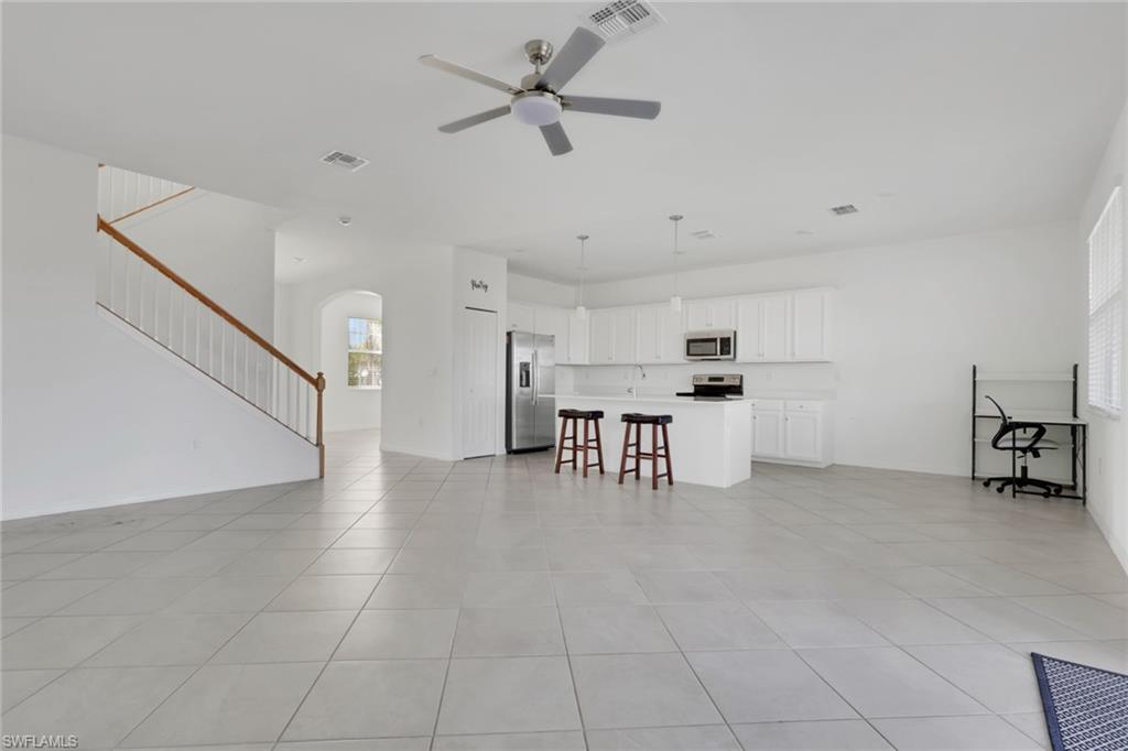 2553 Kona Way Naples, FL 34120 - Photo 7 of 27 a dining room with furniture and entryway