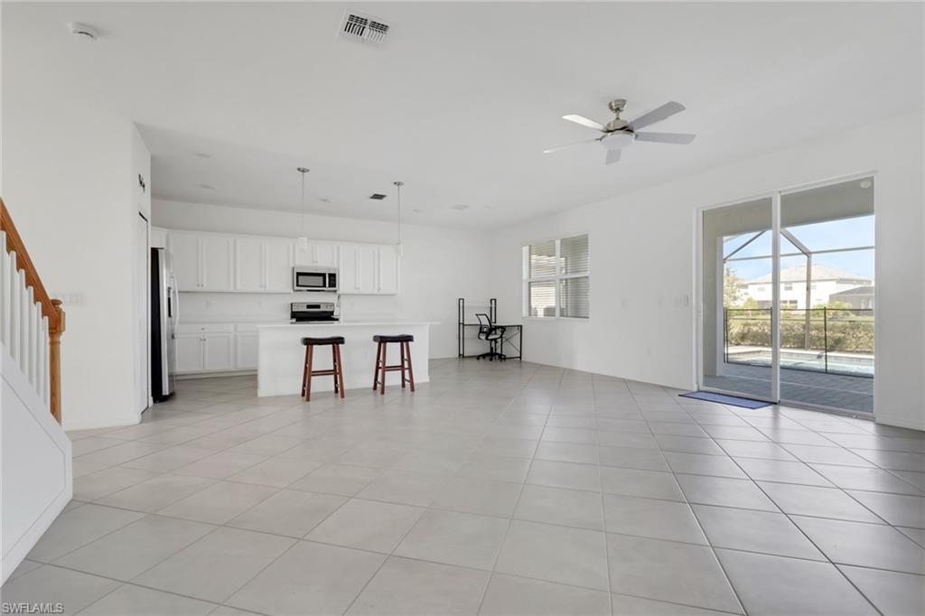 2553 Kona Way Naples, FL 34120 - Photo 8 of 27 a view of kitchen with furniture and window