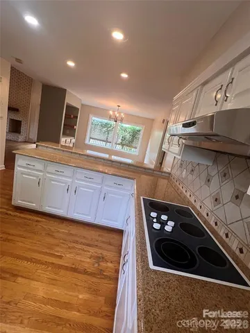 a kitchen with a stove and a sink